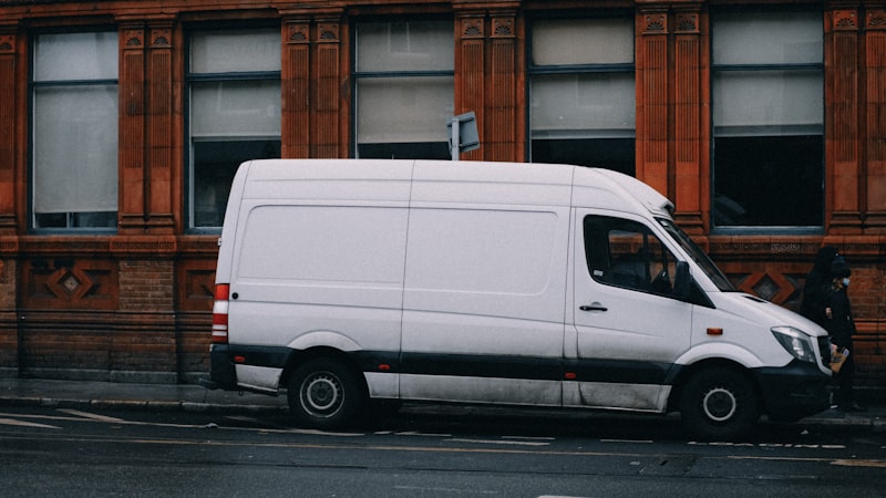 White service truck parked at a residential property — field route technician ready for the next job